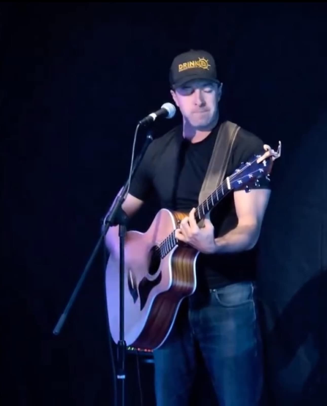 Nik Mathews performing solo acoustic